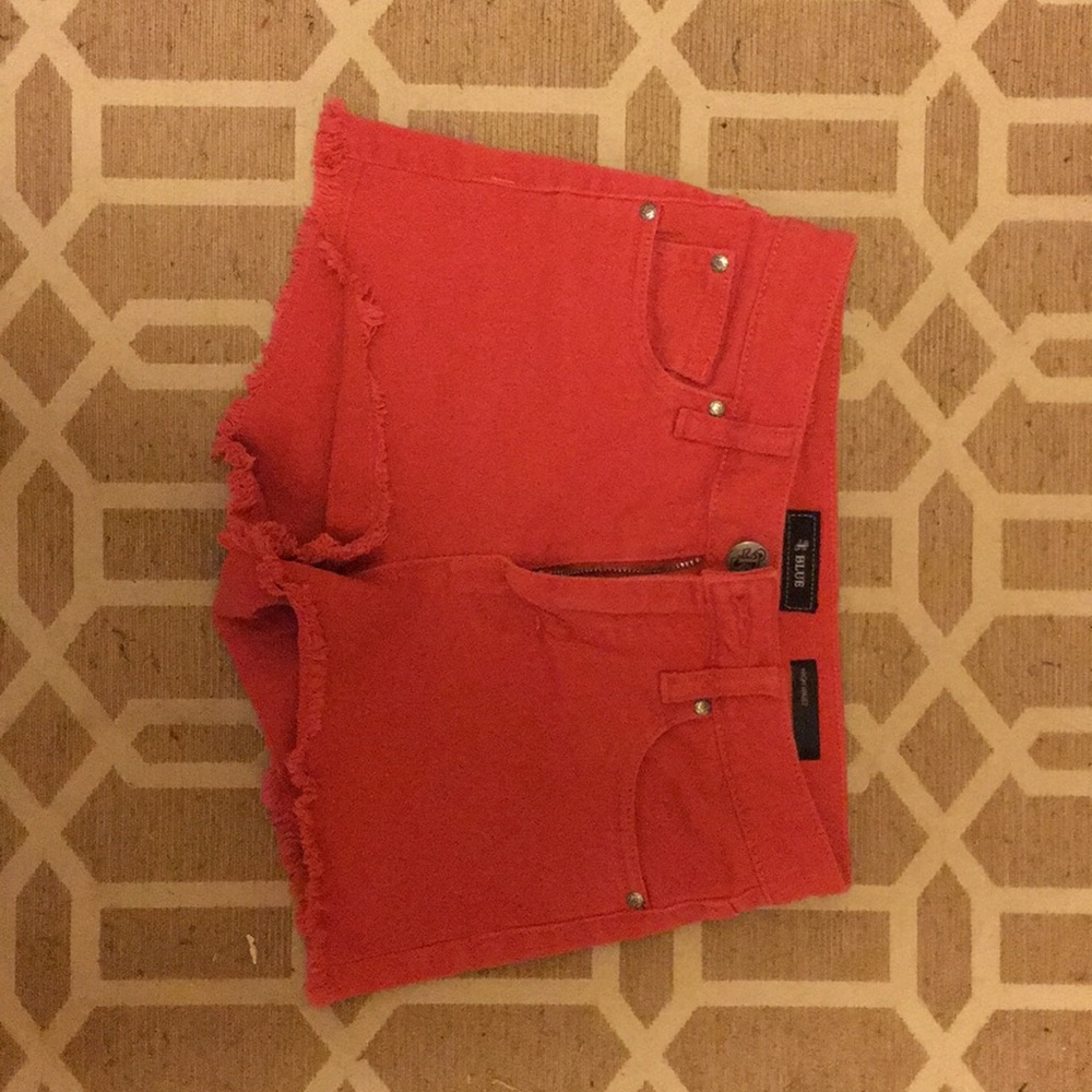 btwn a rusty red&coral color high waisted shorts